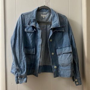 Light wash jean jacket button up through neck and cuffs